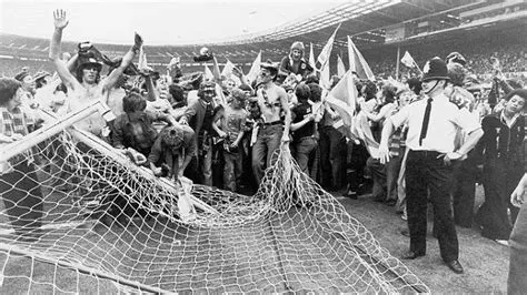 Sc0ttish football fans recycling the English goal at Wembley after the 2-1 win by Scotland against England in 1977.